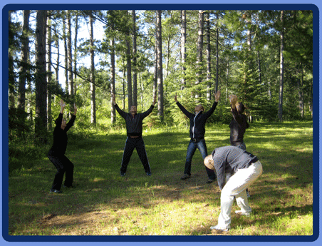 students practicing qigong in the woods